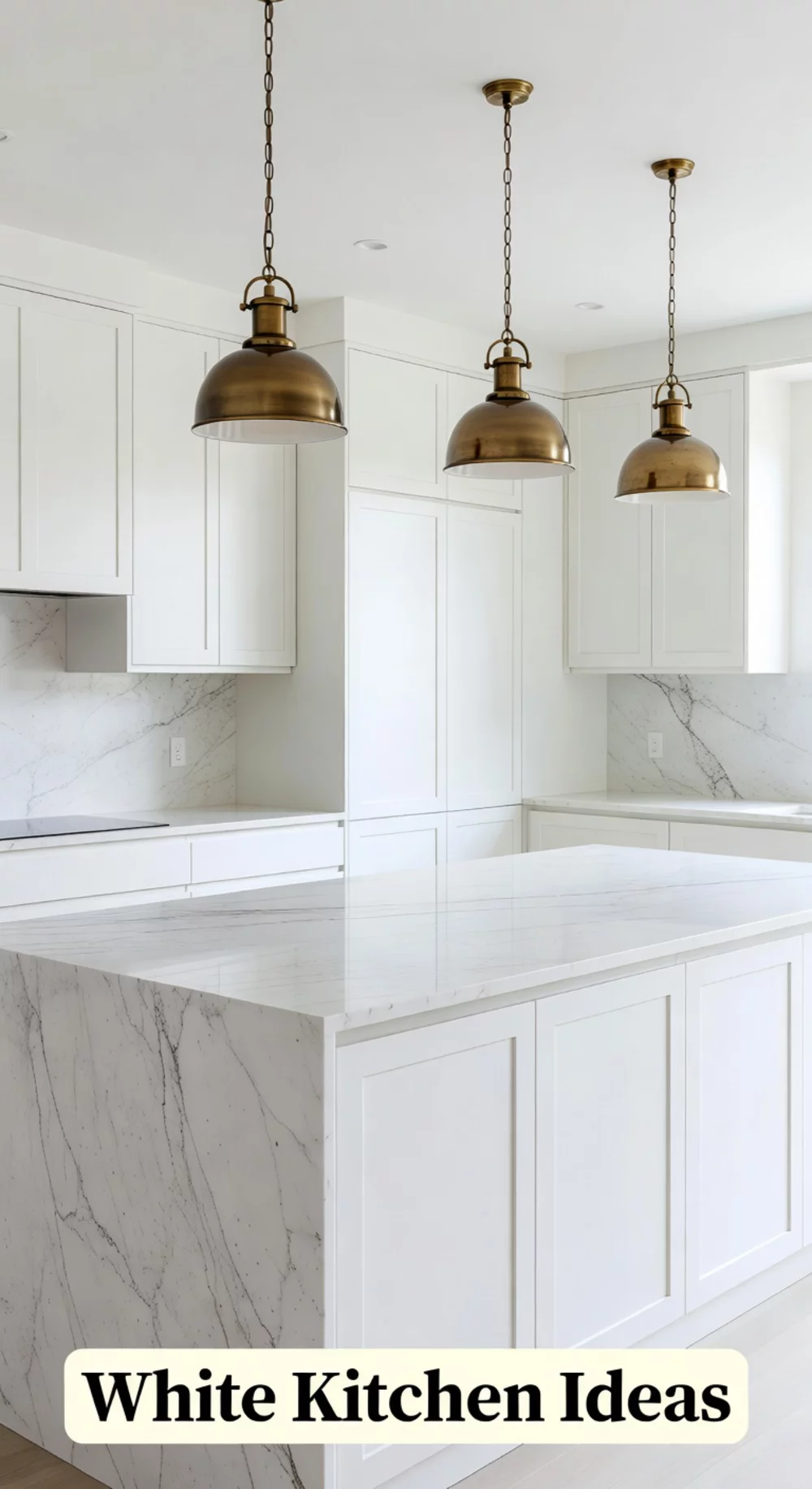 White Kitchen Cabinets with Marble Countertops and Pendant Lights